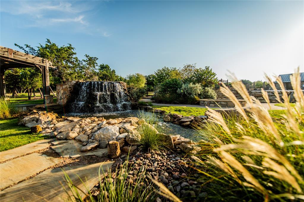 2050 Vista View Graford, TX 76449 - Photo 33 of 35 View of home's community with a garden pond