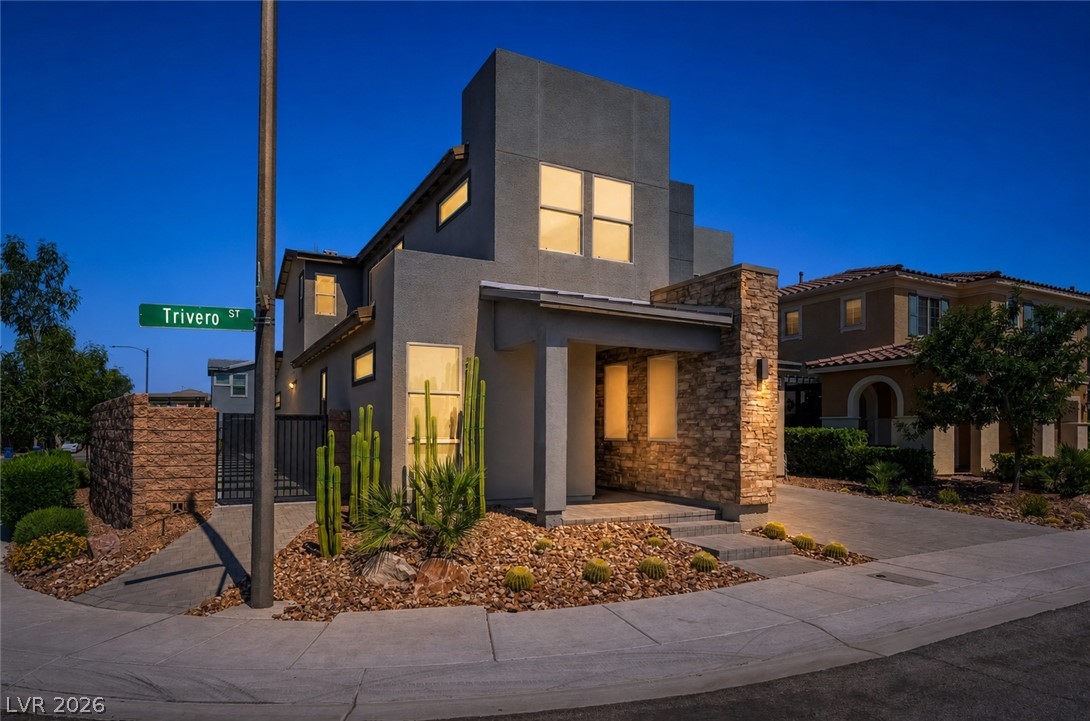 2166 Trivero Street Henderson, NV 89044 - Photo 47 of 61 Modern desert architecture with stone accents and a low-maintenance landscape.