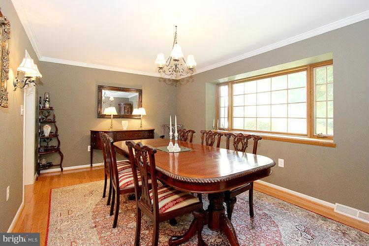 11803 Foxclove Road Reston, VA 20191 - Photo 3 of 30 a view of a dining room with furniture window and wooden floor