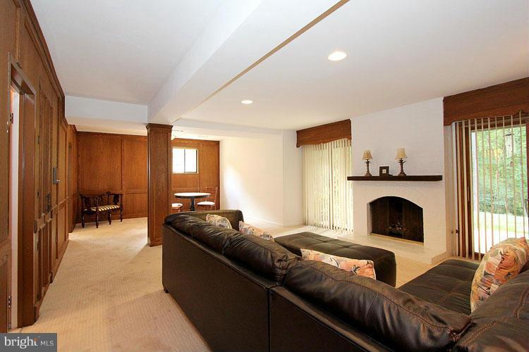11803 Foxclove Road Reston, VA 20191 - Photo 22 of 30 a living room with furniture and a fireplace