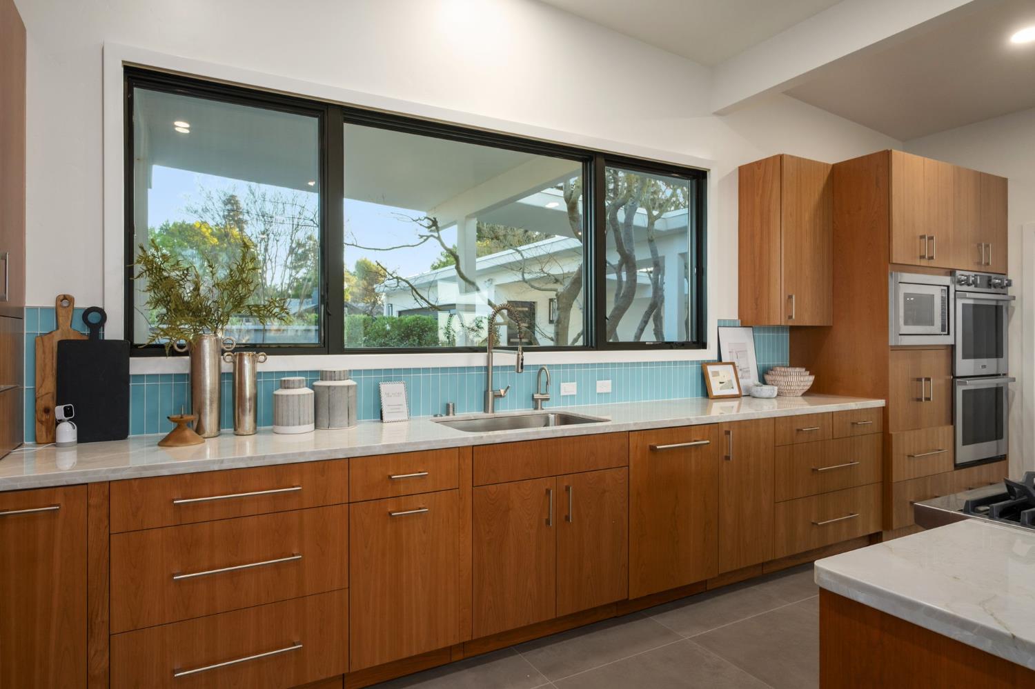 1230 West Moraga Road Fresno, CA 93711 - Photo 20 of 66 a kitchen with a sink and large window