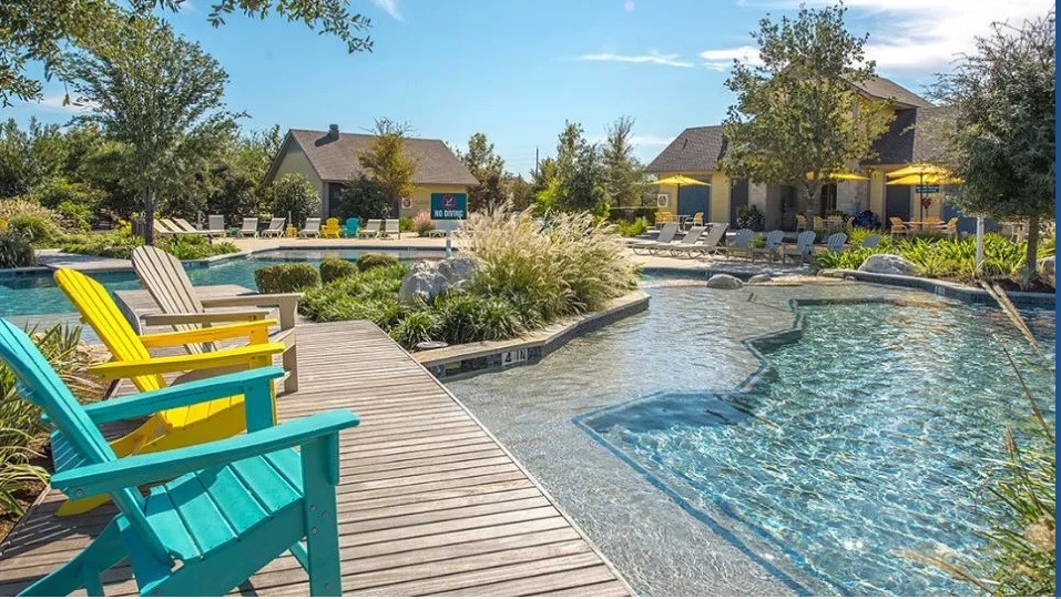 11938 Golden Cove Rosharon, TX 77583 - Photo 3 of 8 a view of a swimming pool with a patio