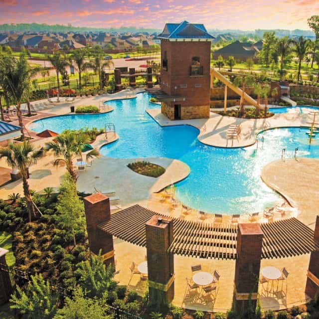 11938 Golden Cove Rosharon, TX 77583 - Photo 5 of 8 a view of a swimming pool with a lounge chairs