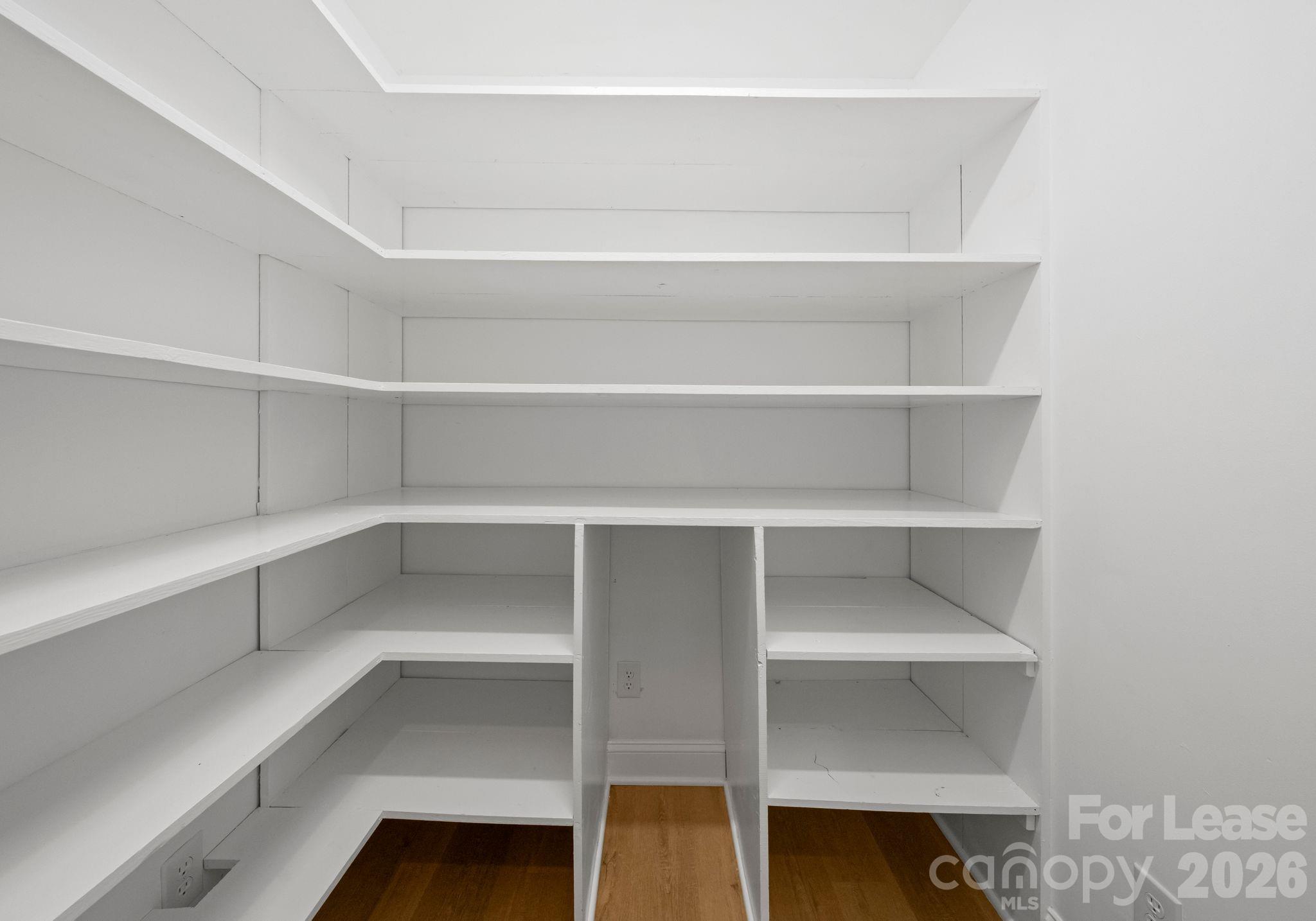 19709 Stough Farm Road Cornelius, NC 28031 - Photo 10 of 48 a view of walk in closet with empty racks