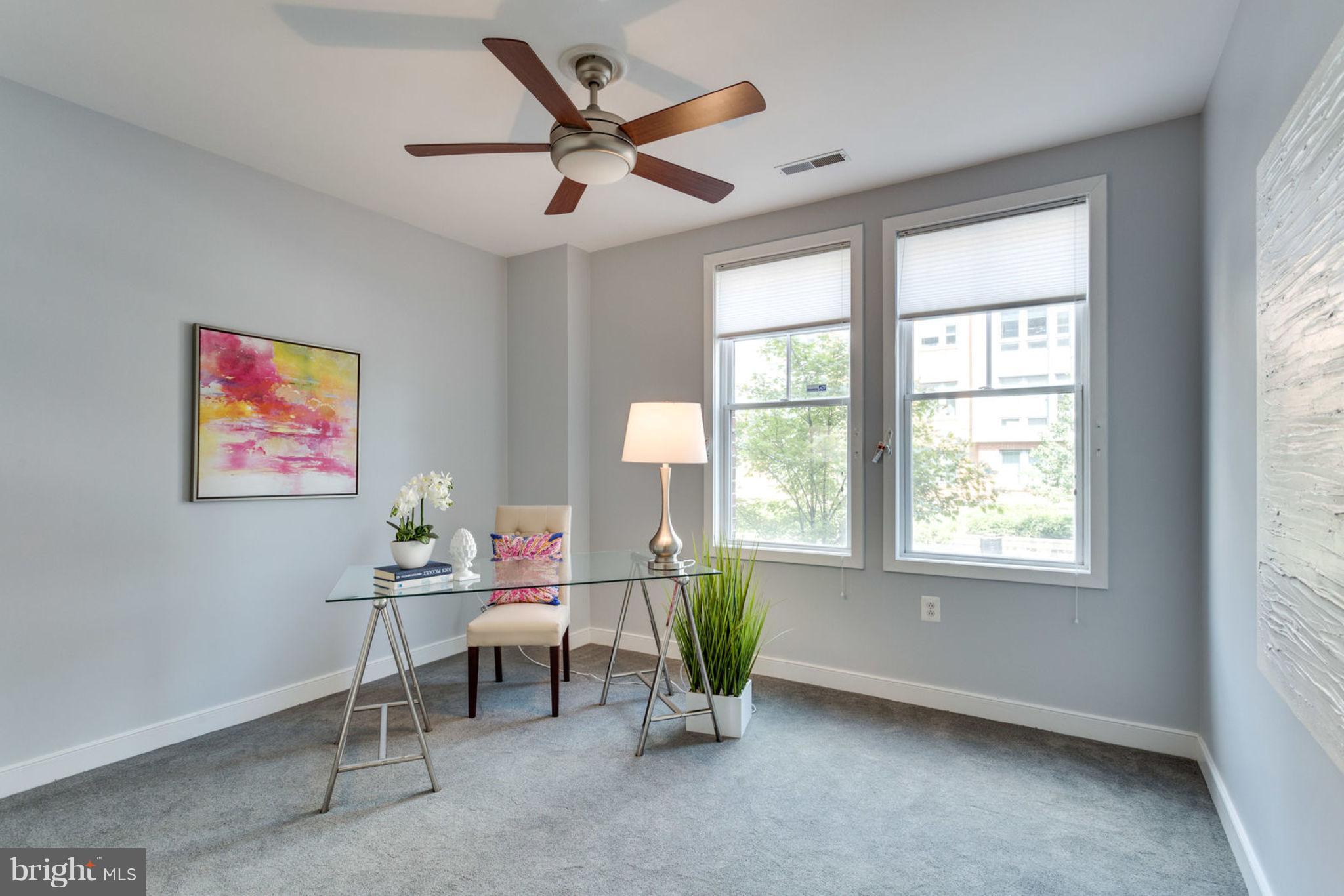 181 East Reed Avenue, Unit 109 Alexandria, VA 22305 - Photo 13 of 30 a living room with furniture and windows