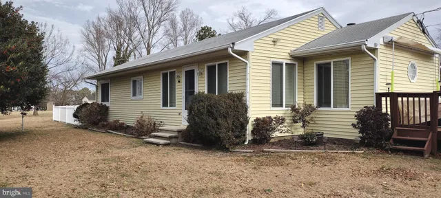 a view of a house with a yard and garage