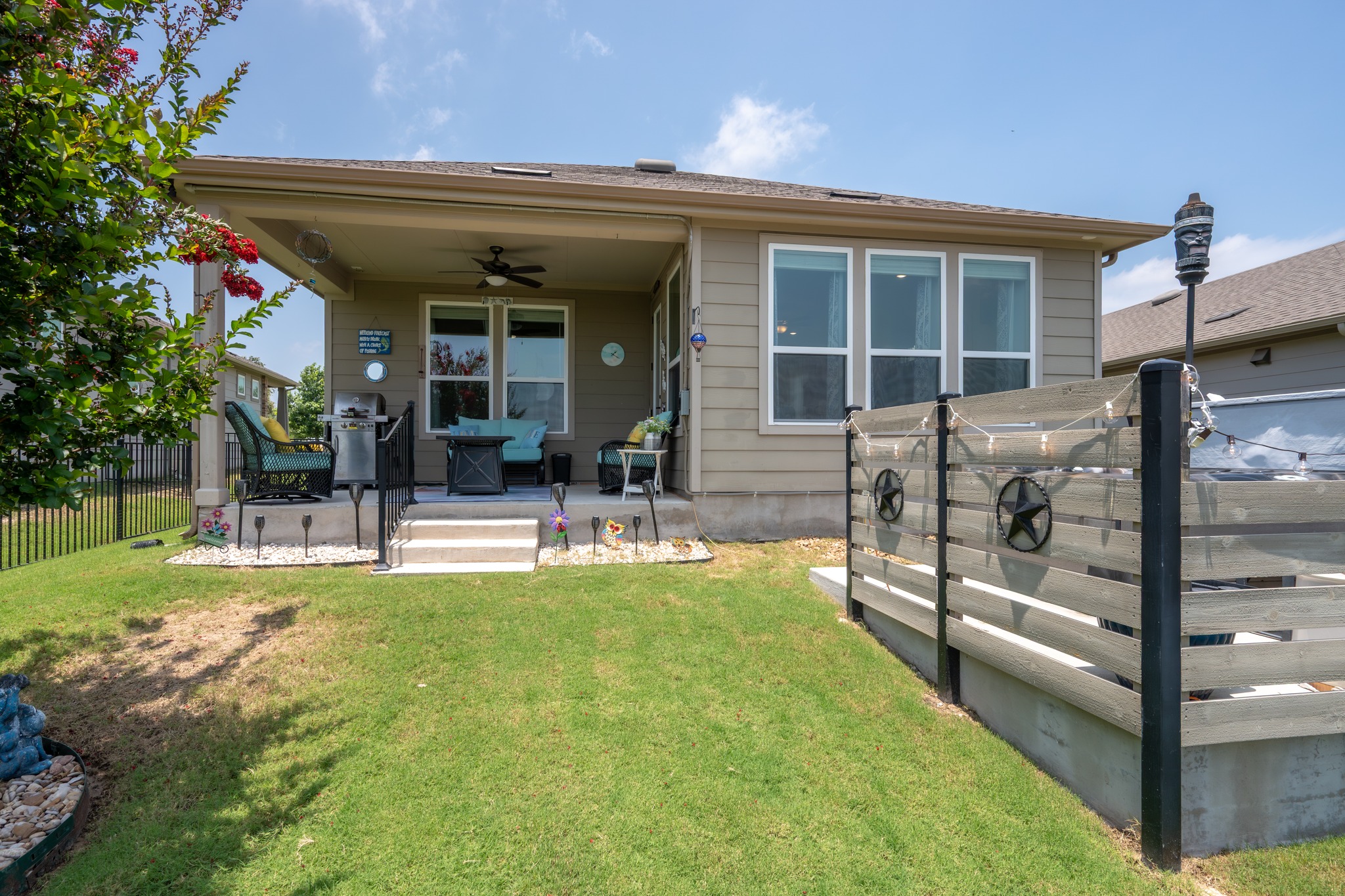 202 Yorktown Street Georgetown, TX 78633 - Photo 20 of 35 Unwind on the covered patio or relax in the hot tub and enjoy serene views.