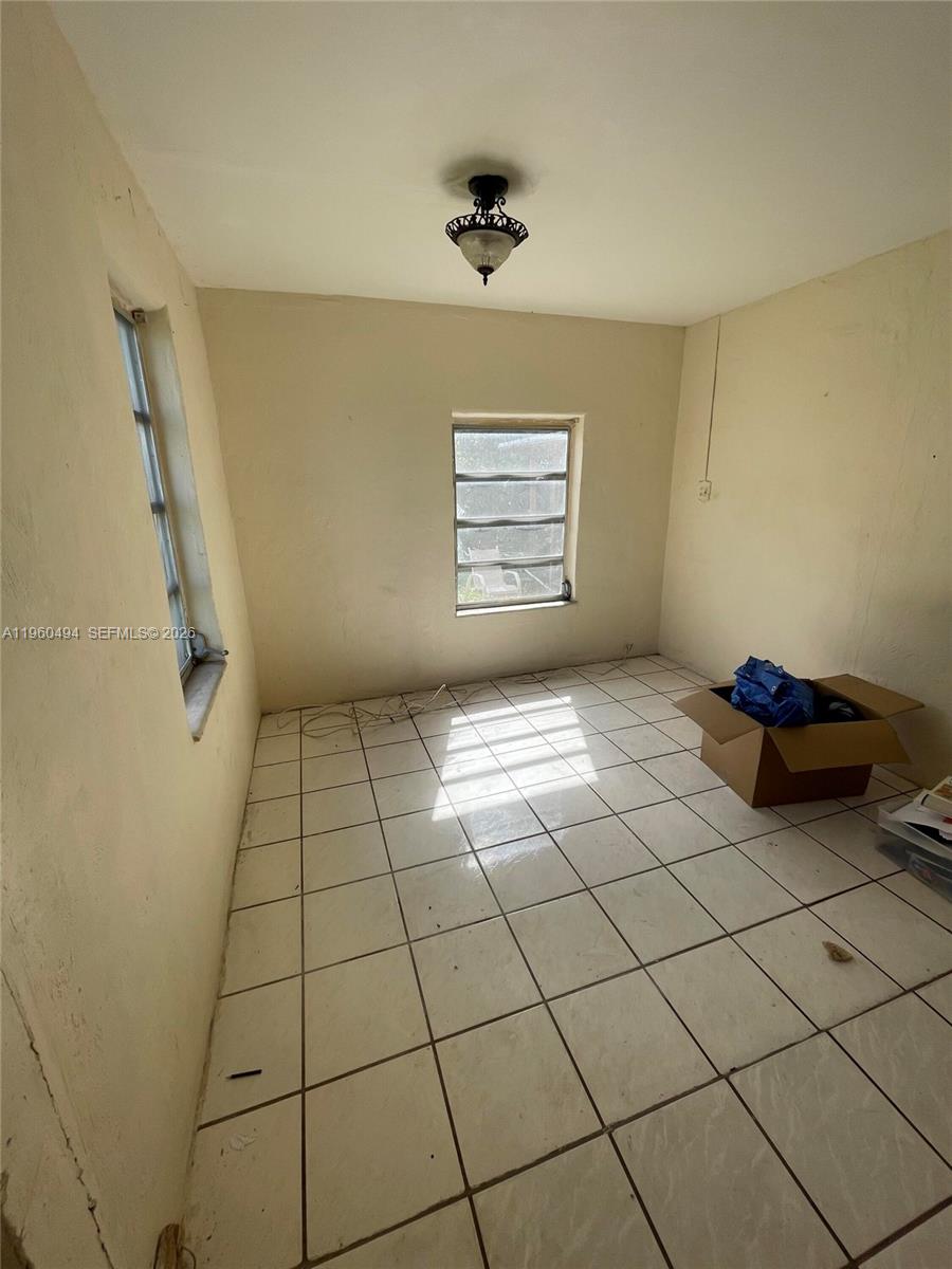 3630 Northwest 98th Street Miami, FL 33147 - Photo 21 of 38 a view of an empty room and window