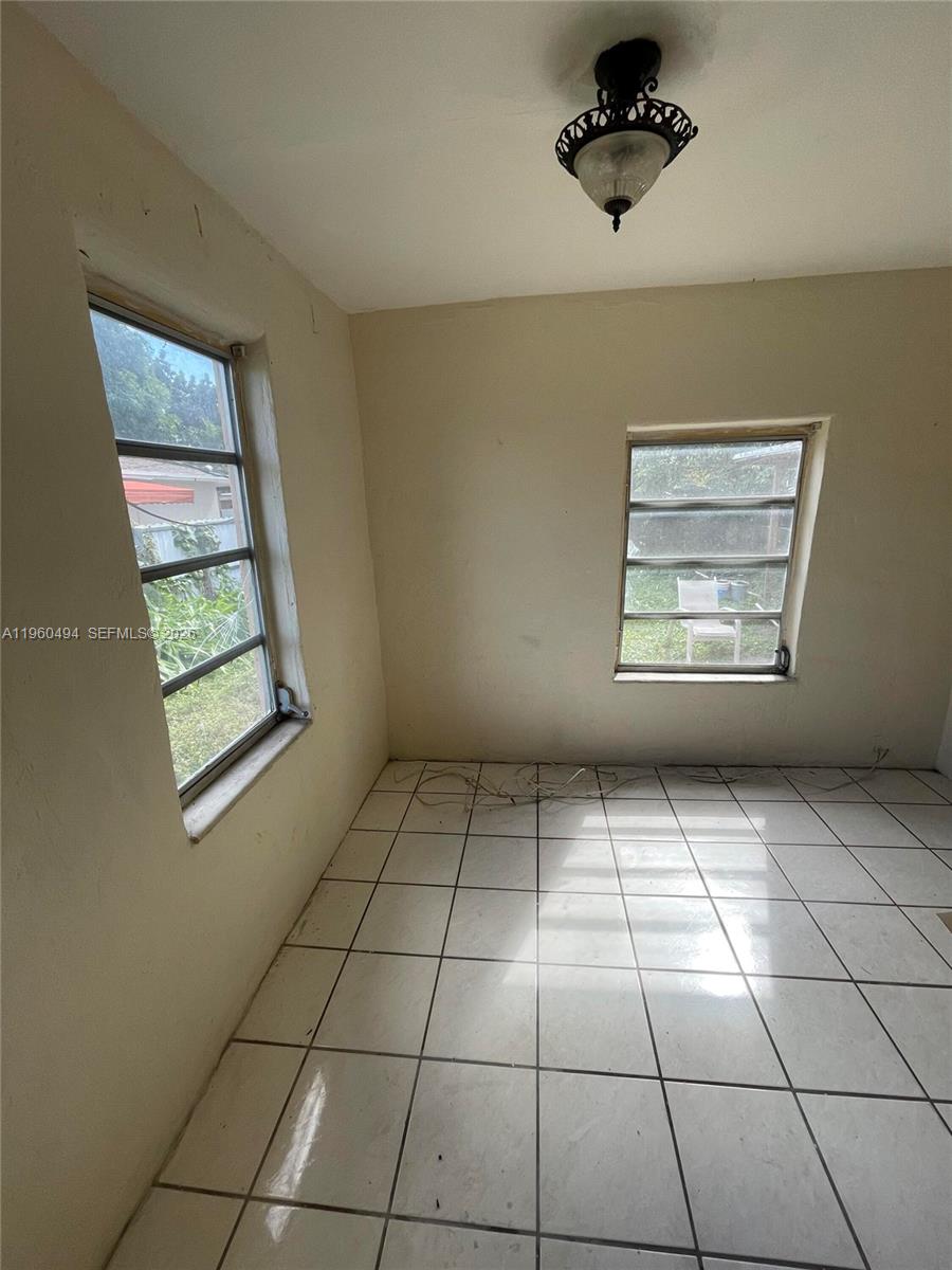 3630 Northwest 98th Street Miami, FL 33147 - Photo 22 of 38 a view of an empty room with windows