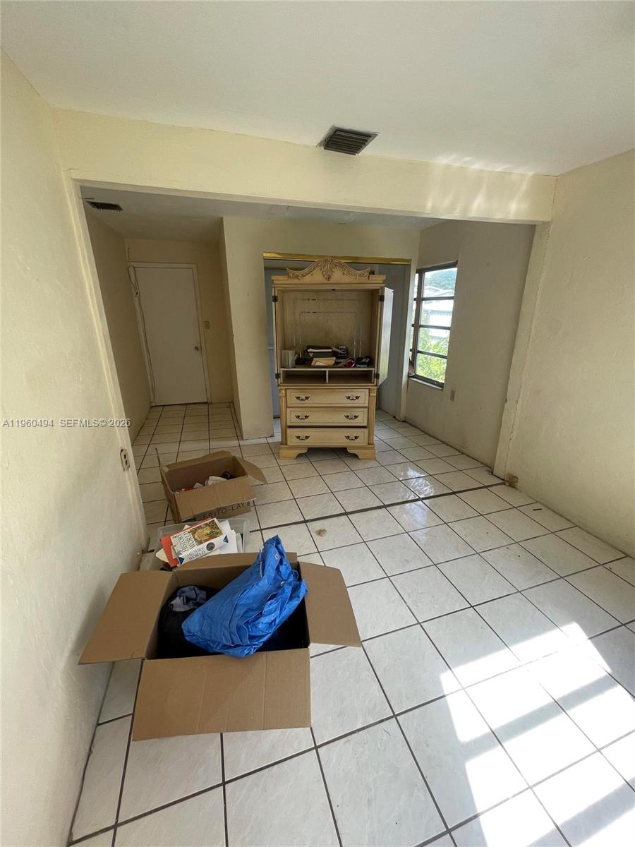 3630 Northwest 98th Street Miami, FL 33147 - Photo 23 of 38 a living room with furniture and a window