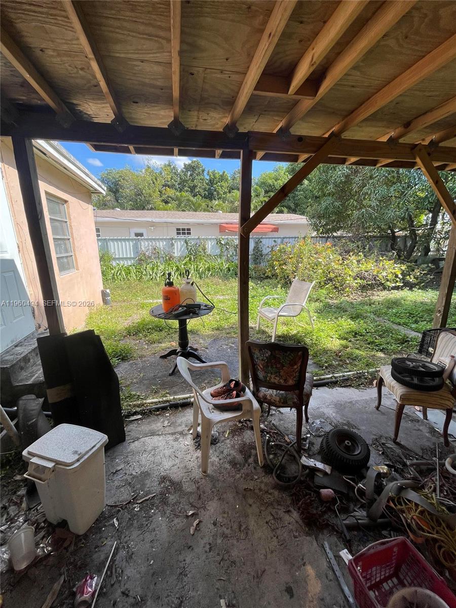3630 Northwest 98th Street Miami, FL 33147 - Photo 38 of 38 a living room with patio furniture and a garden