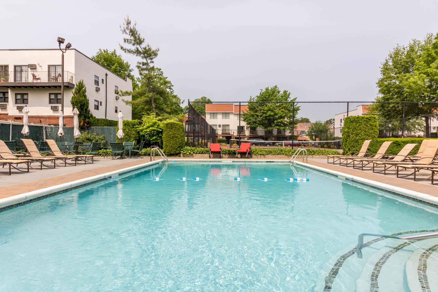 509 Julius Road Queens, NY 11356 - Photo 7 of 26 a swimming pool with outdoor seating and yard