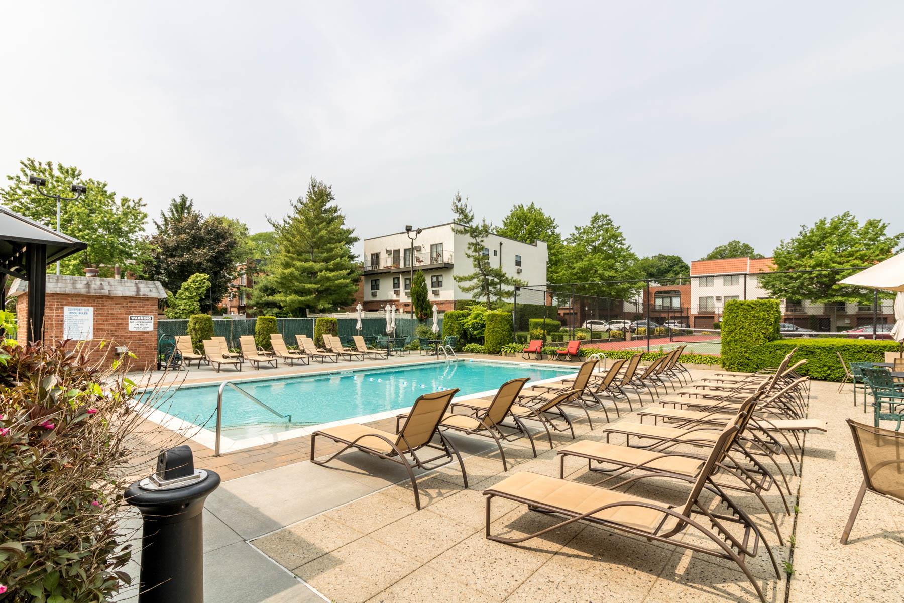 509 Julius Road Queens, NY 11356 - Photo 8 of 26 a view of a swimming pool with outdoor seating and plants