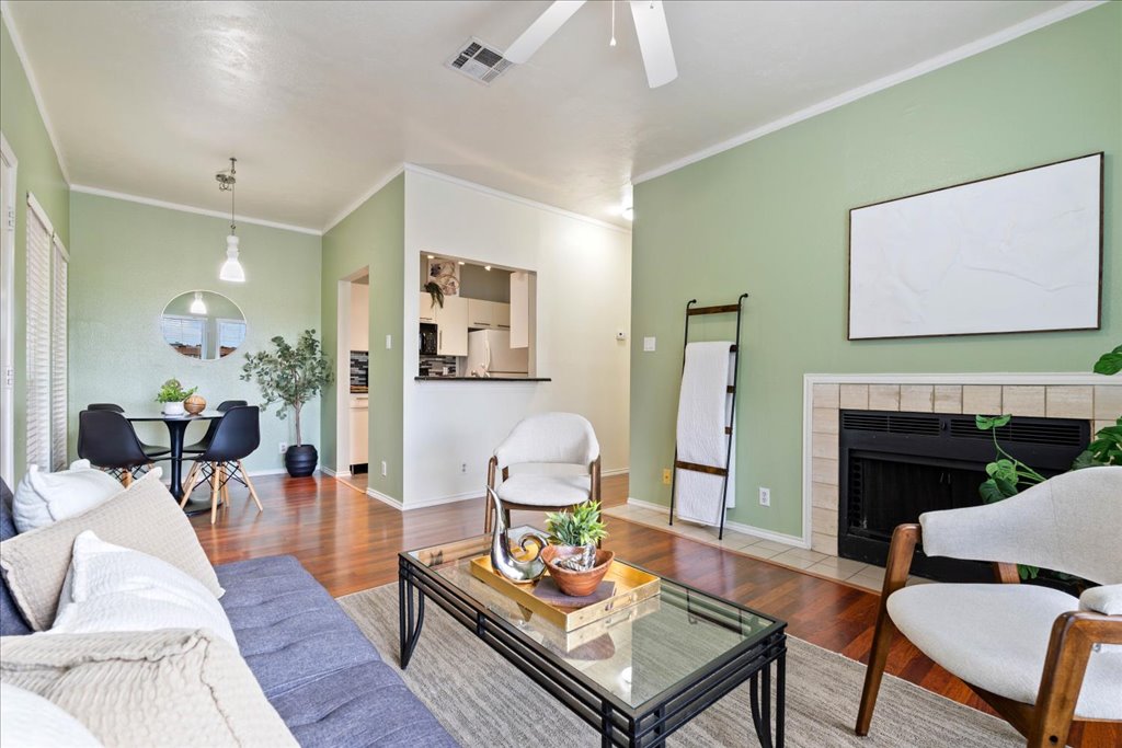 a living room with furniture and a fireplace