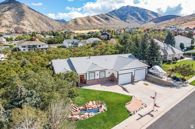569 Elk Meadow Loop Tooele, UT 84074 - Photo 49 of 56 Aerial view of residential area featuring a mountain backdrop