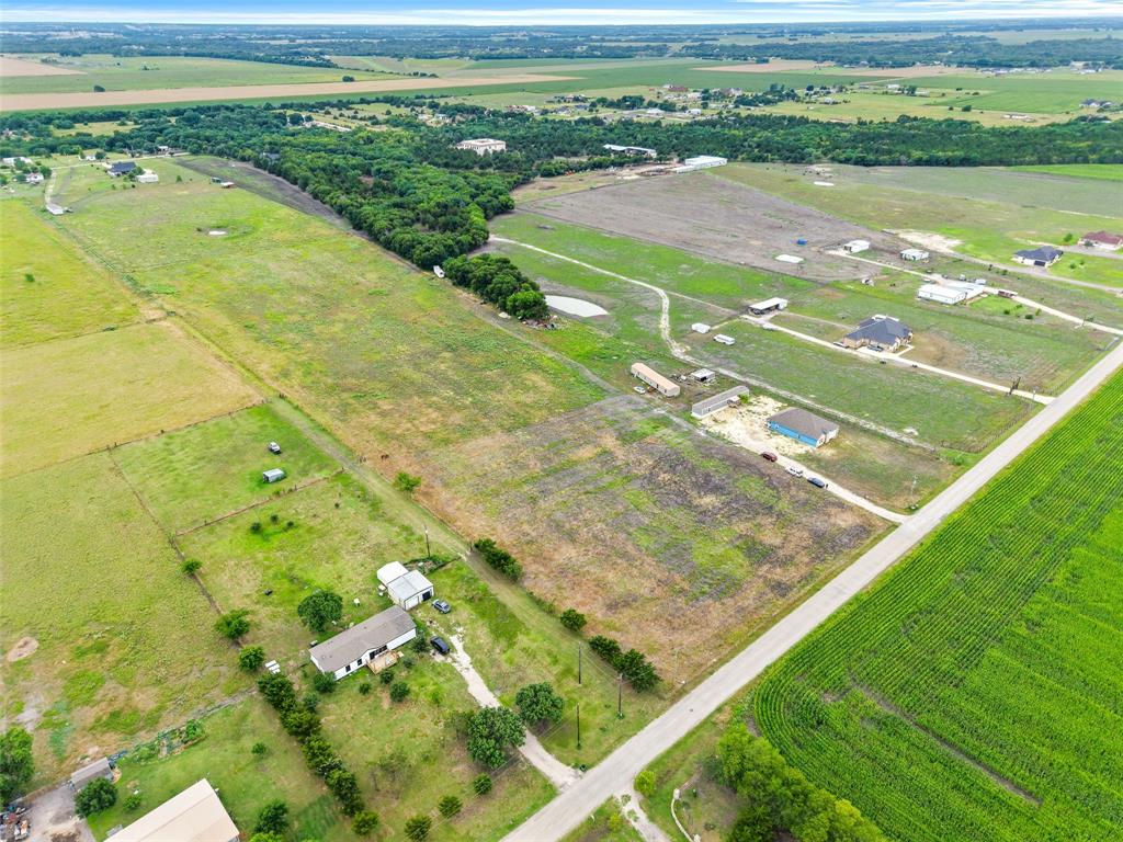0 Ewing Road Ferris, TX 75125 - Photo 26 of 29 Expansive rural landscape featuring a mix of cultivated fields and undeveloped land