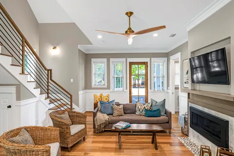 a living room with furniture and a fireplace