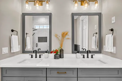 a bathroom with sink and a mirror