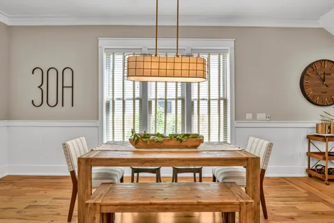 a dining room with furniture and window