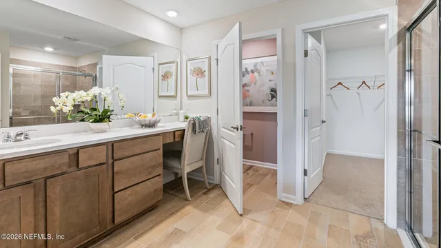 a kitchen with stainless steel appliances a stove a sink refrigerator and microwave