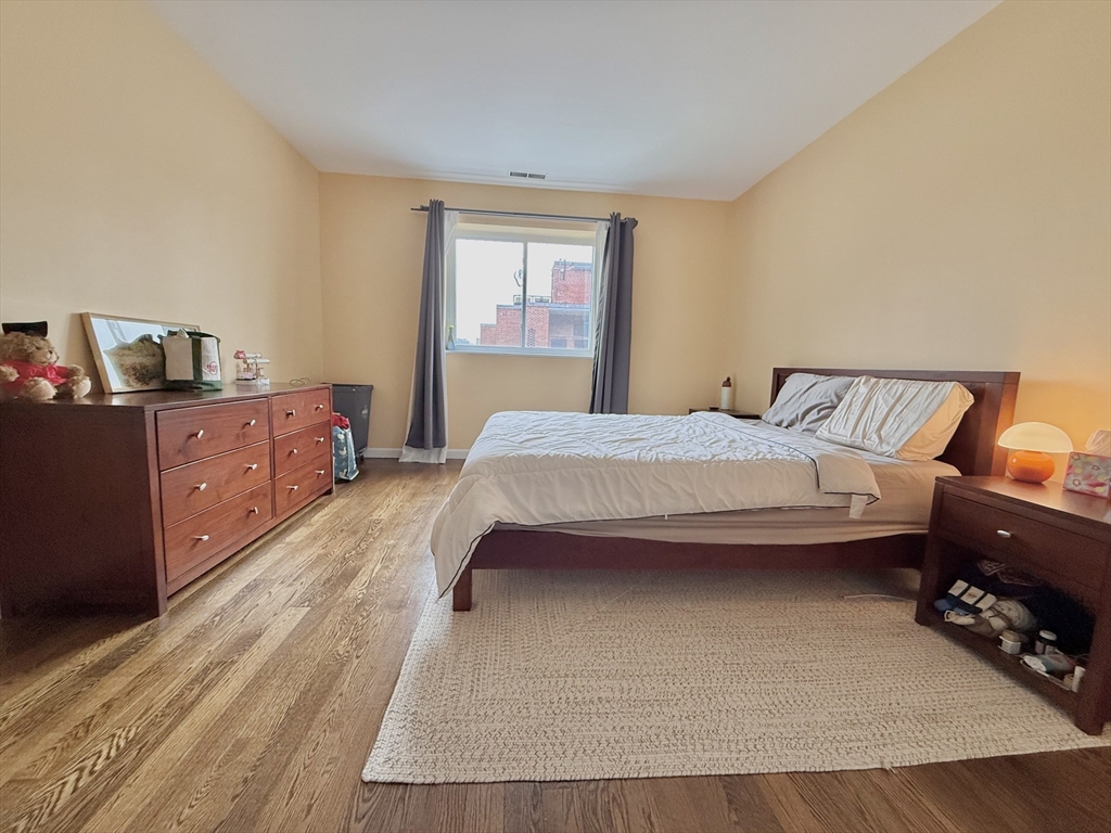 20 Stearns Road, Unit 45 Brookline, MA 02446 - Photo 10 of 22 a bedroom with a bed and window