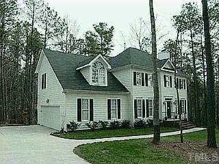 5728 North Hawthorne Way Raleigh, NC 27613 - Photo 1 of 1 a front view of a house with a yard