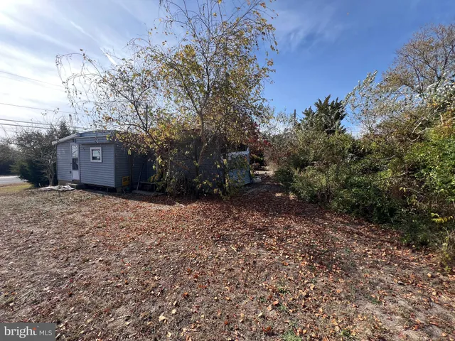 a house view with a backyard space
