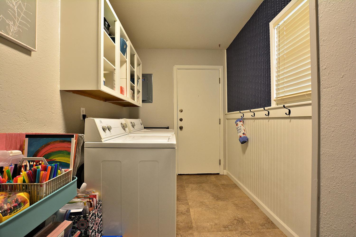 4903 17th Street Lubbock, TX 79416 - Photo 15 of 25 a utility room with dryer and washer