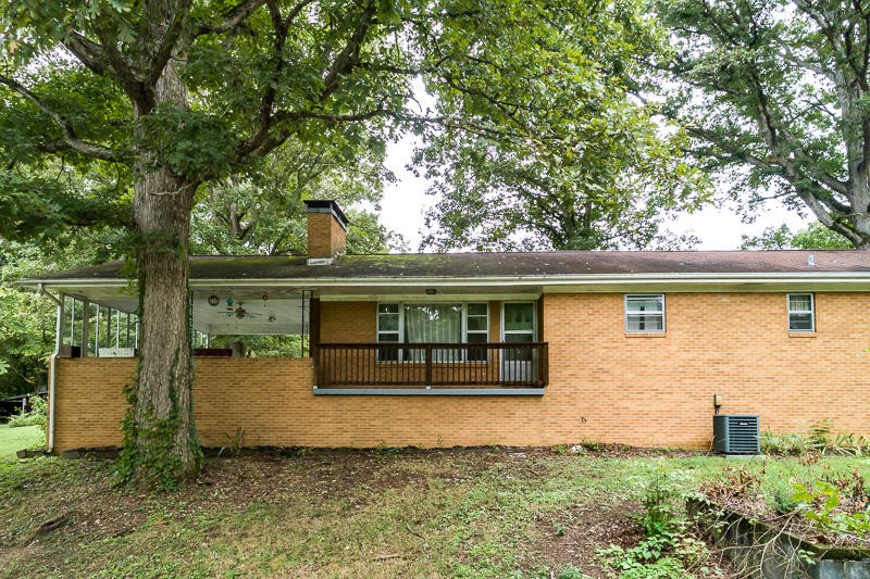 446 Powder House Road Powell, TN 37849 - Photo 1 of 36 front view of a house with a small yard