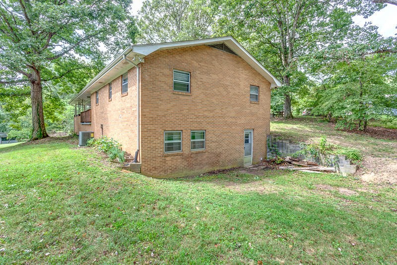 446 Powder House Road Powell, TN 37849 - Photo 4 of 36 a view of a house with backyard and garden