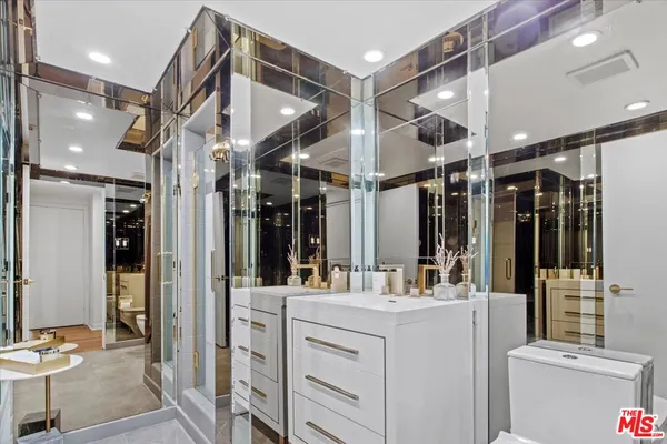 a bathroom with a double vanity sink mirror and double