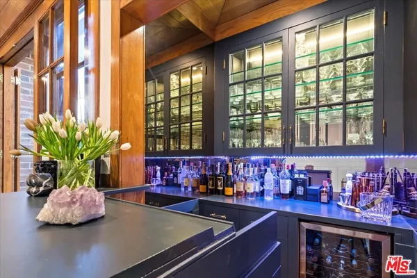 a large kitchen with stainless steel appliances granite countertop a lot of counter space and a sink
