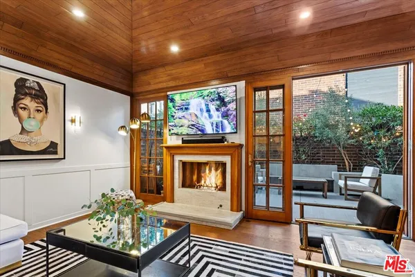 a bedroom with a bed and a view of closet