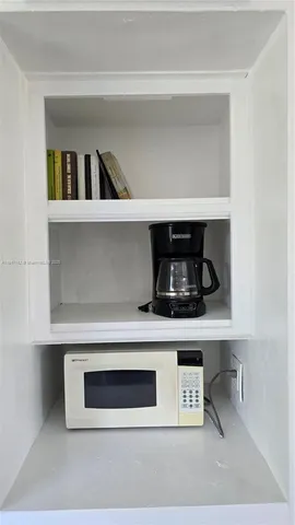 a view of storage and utility room with washer and dryer