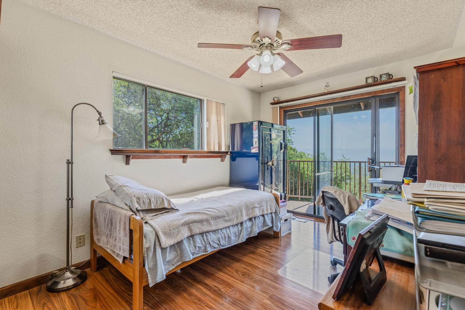 3120 Iron Mine Road Auburn, CA 95602 - Photo 12 of 38 a bedroom with a bed a flat screen tv and a large window