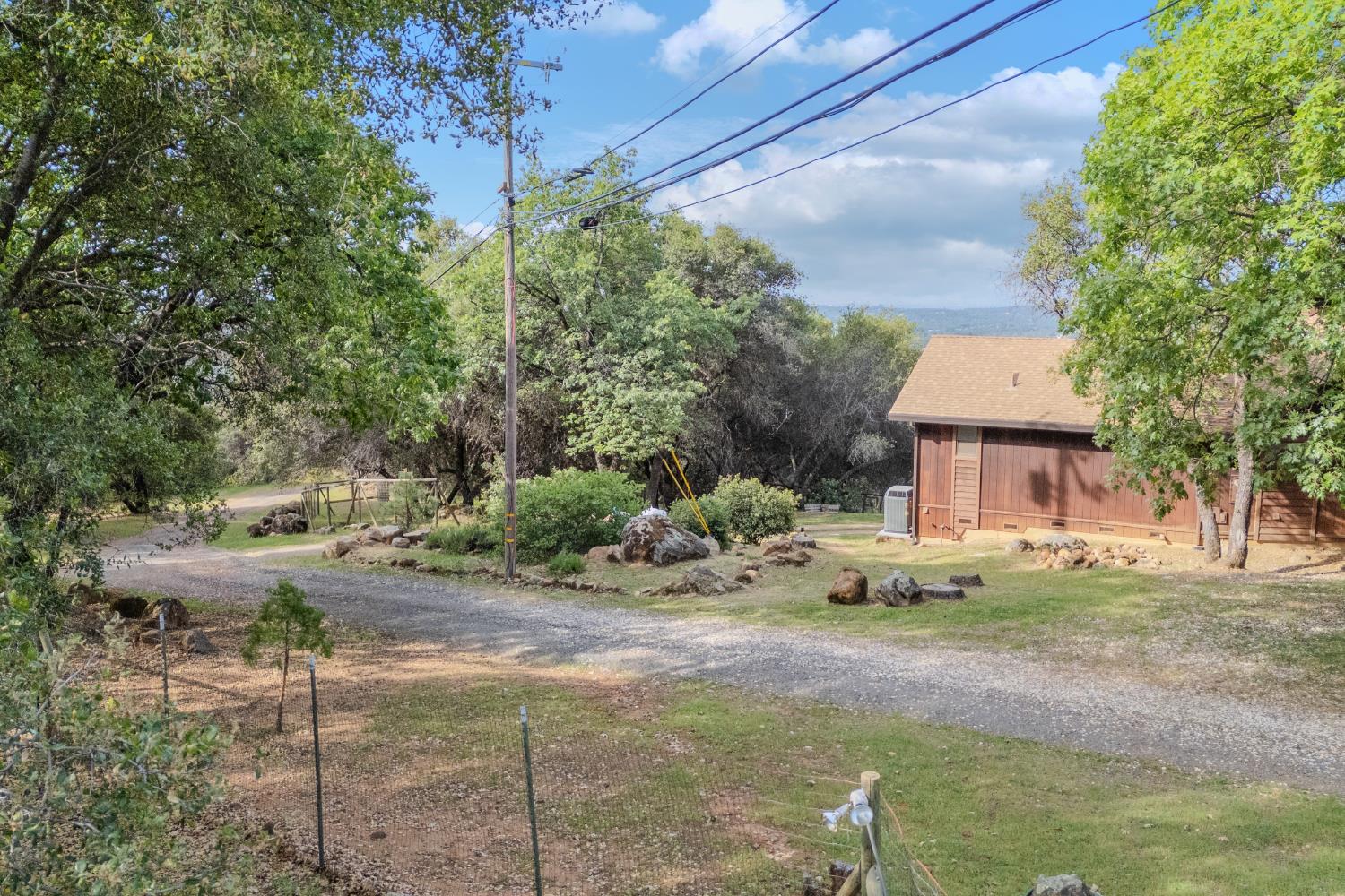 3120 Iron Mine Road Auburn, CA 95602 - Photo 16 of 38 a front view of a house with a yard