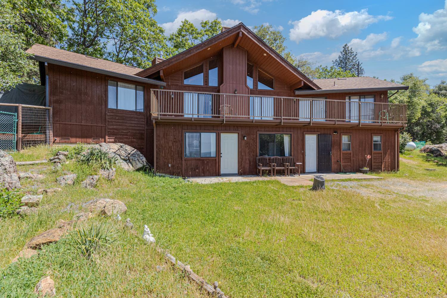 3120 Iron Mine Road Auburn, CA 95602 - Photo 2 of 38 a front view of a house with swimming pool
