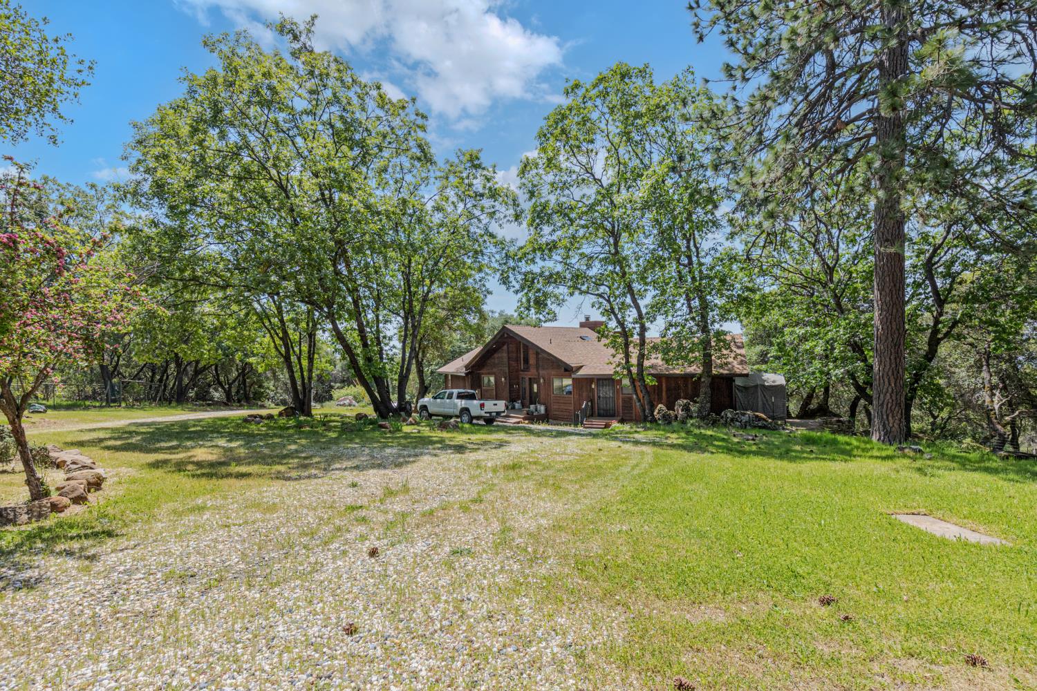 3120 Iron Mine Road Auburn, CA 95602 - Photo 34 of 38 a view of a house with a yard and tree