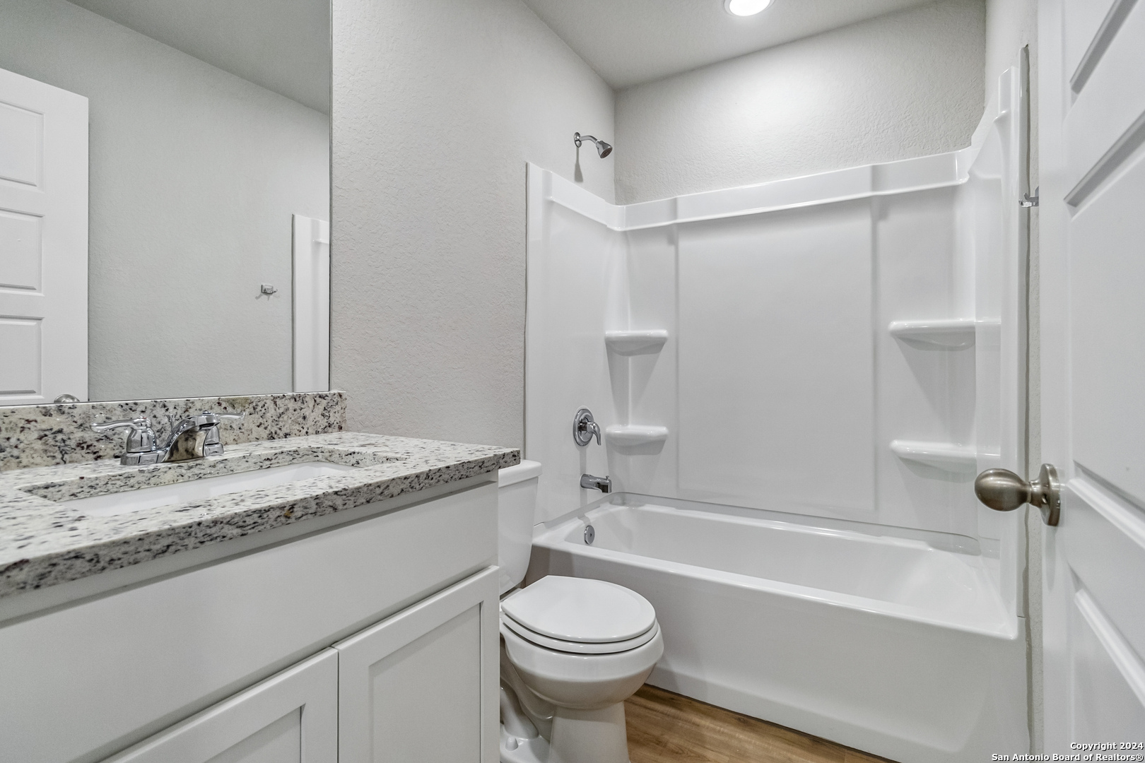 3915 Abbott Pass St. Hedwig, TX 78152 - Photo 22 of 35 a bathroom with a granite countertop sink toilet and shower