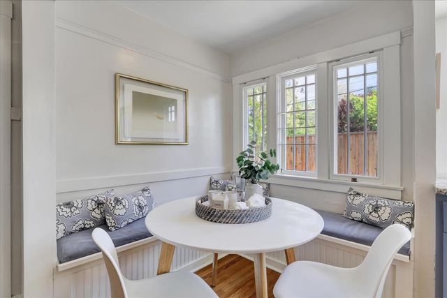a bedroom with a bed and a lamp on dresser