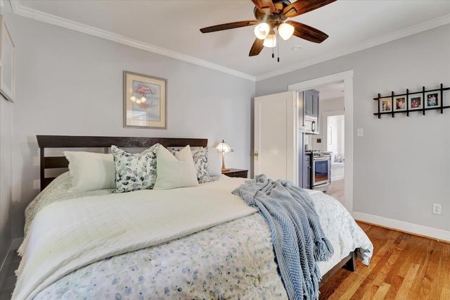a living room with furniture and a dining table