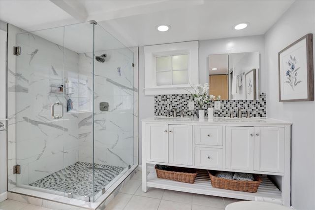 a kitchen with a sink and refrigerator