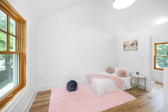 a bathroom with a toilet a sink and a window