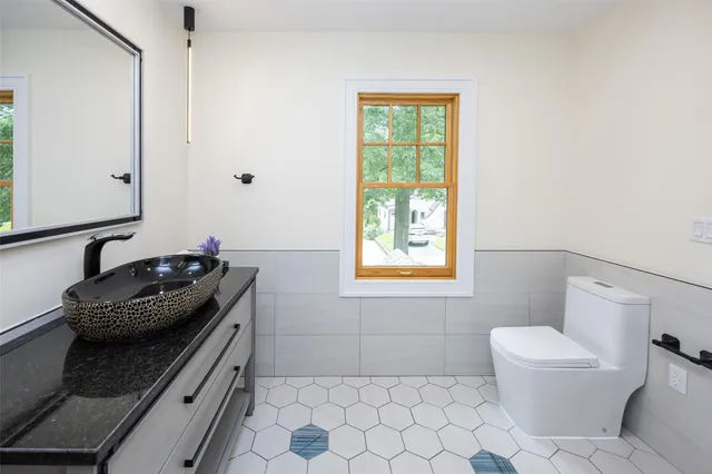 a bedroom with a bed and a desk