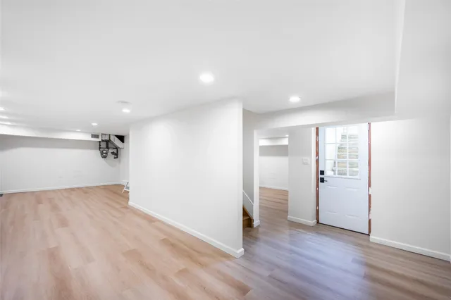 a aerial view of a house with a yard and potted plants