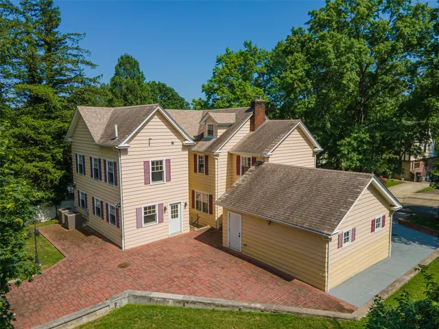 an aerial view of huge green field with lots of green plants in the background
