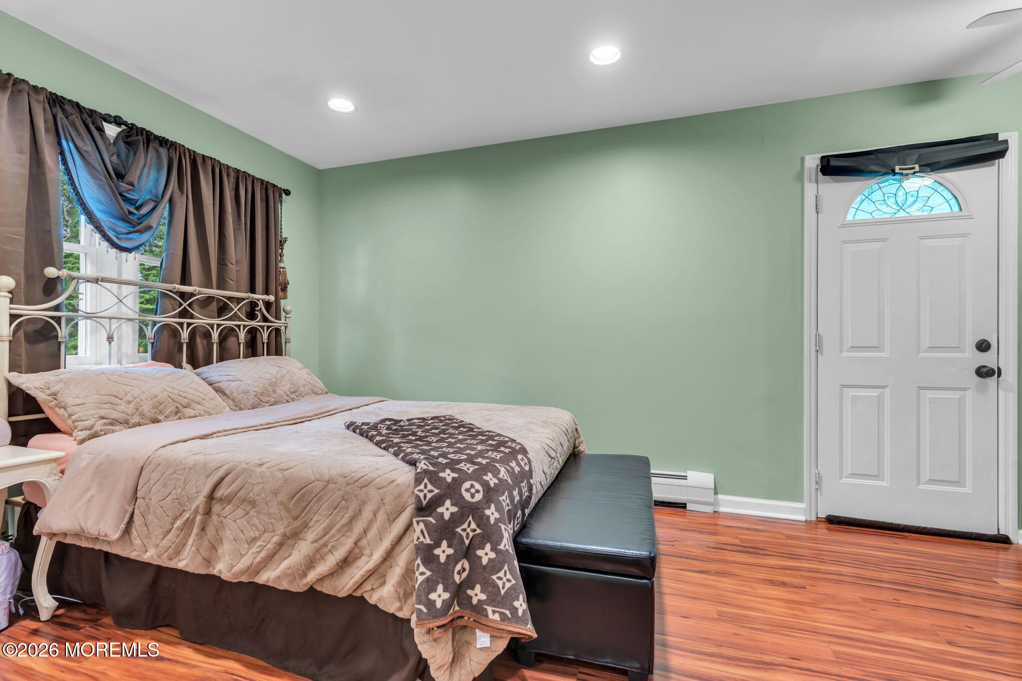 8 Owens Road Marlboro, NJ 07746 - Photo 29 of 39 a bedroom with a bed and wooden floor