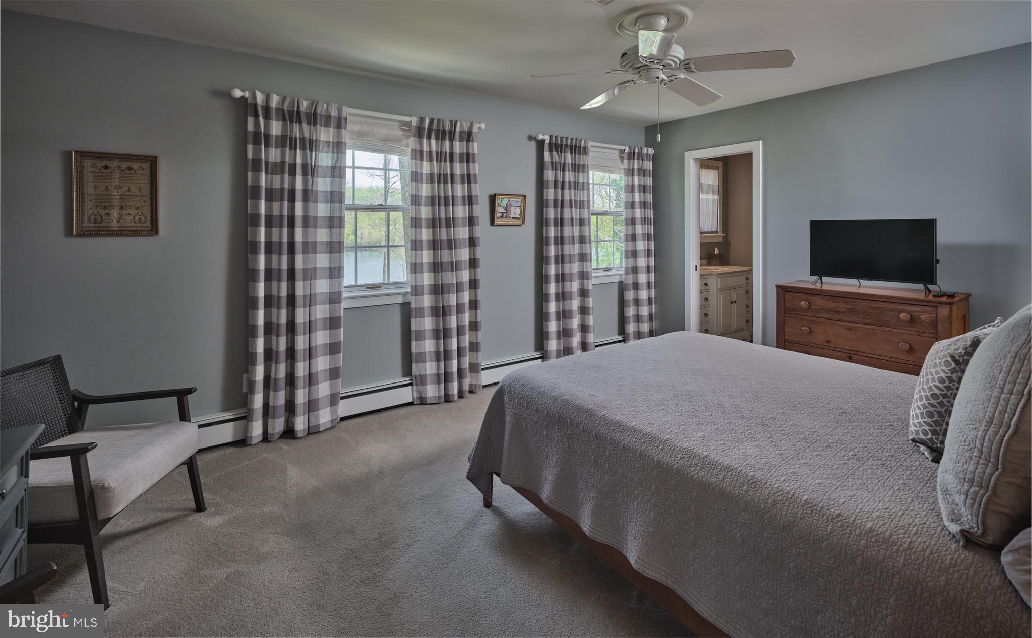 2976 River Road New Hope, PA 18938 - Photo 15 of 37 a bedroom with a bed and a television