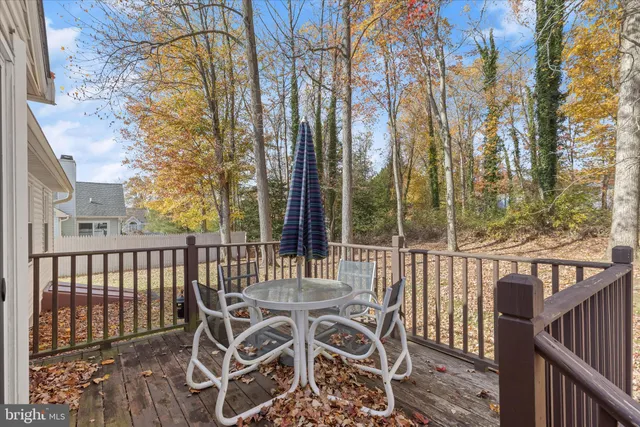 a view of a chair and table on the deck