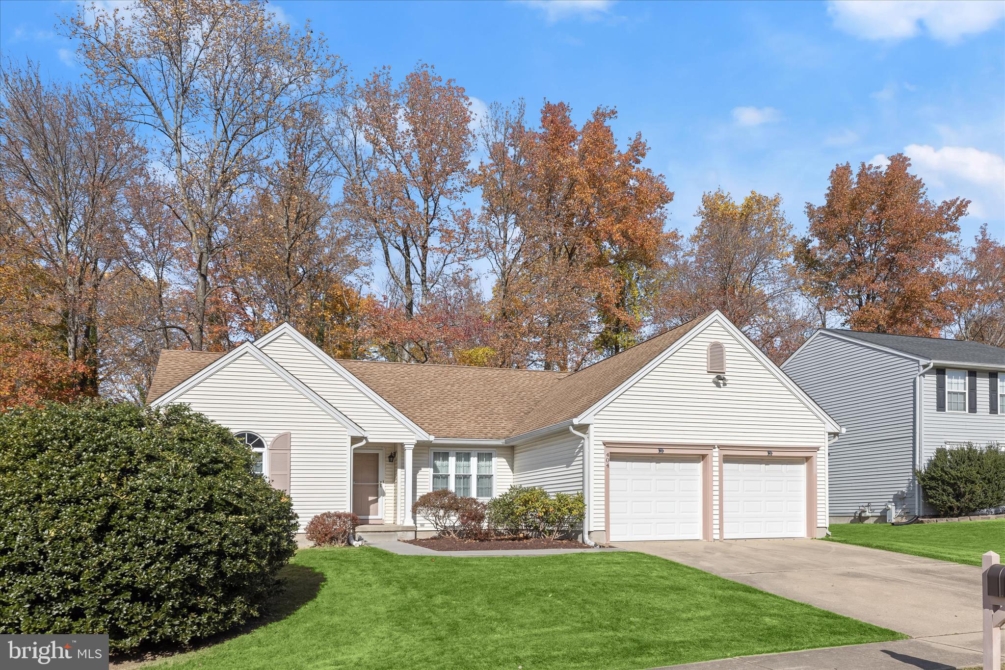 404 Arrow Wood Court Abingdon, MD 21009 - Photo 6 of 24 a front view of a house with a garden and plants
